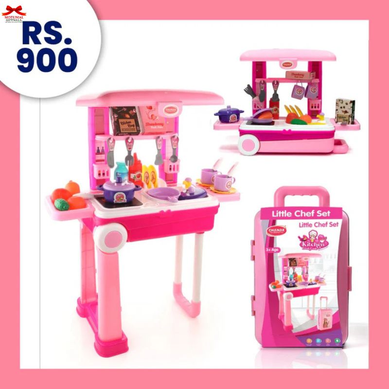 Pink toy kitchen set with accessories and packaging on a white background