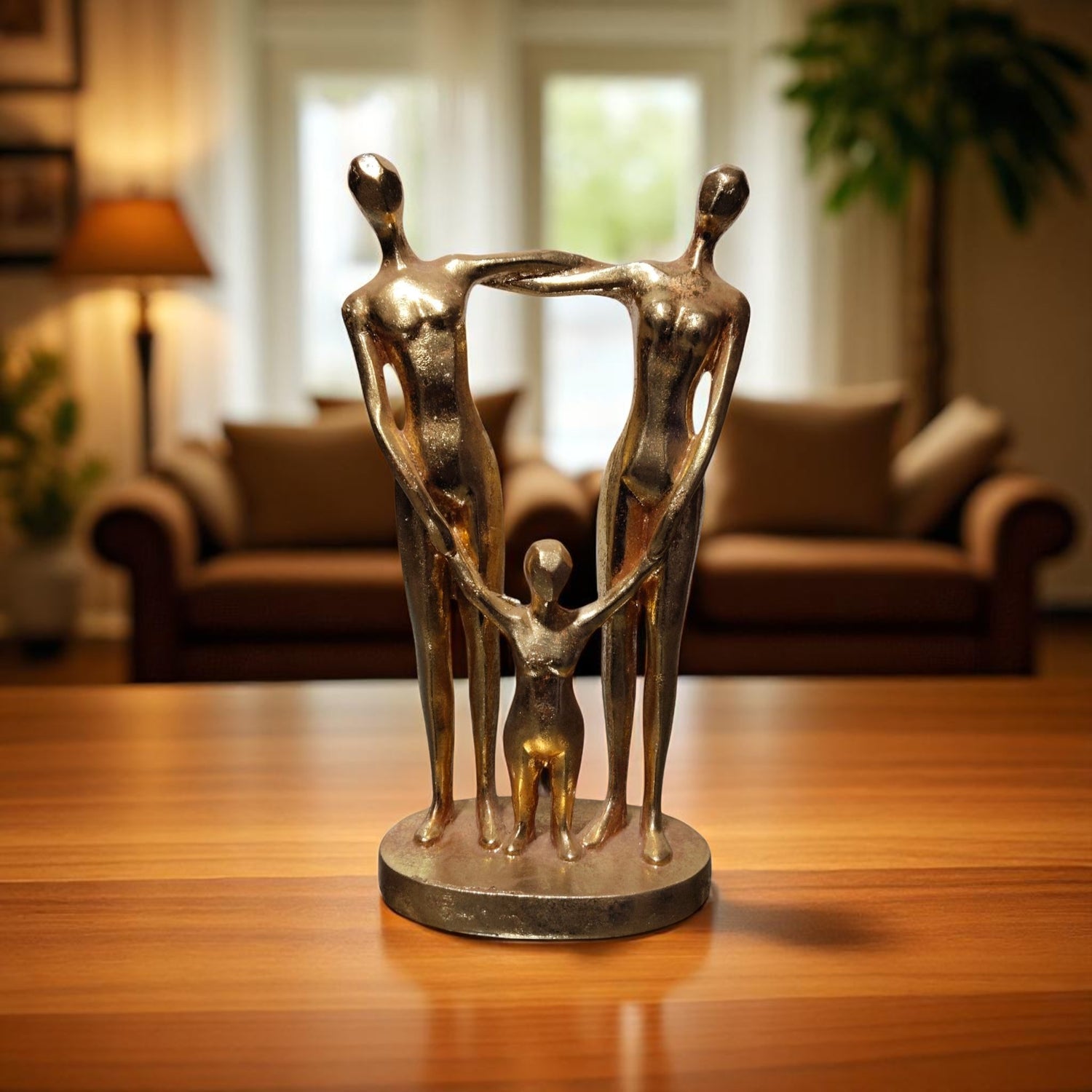 Golden Family Embrace Sculpture – Parents Holding Child in Artistic Style"
