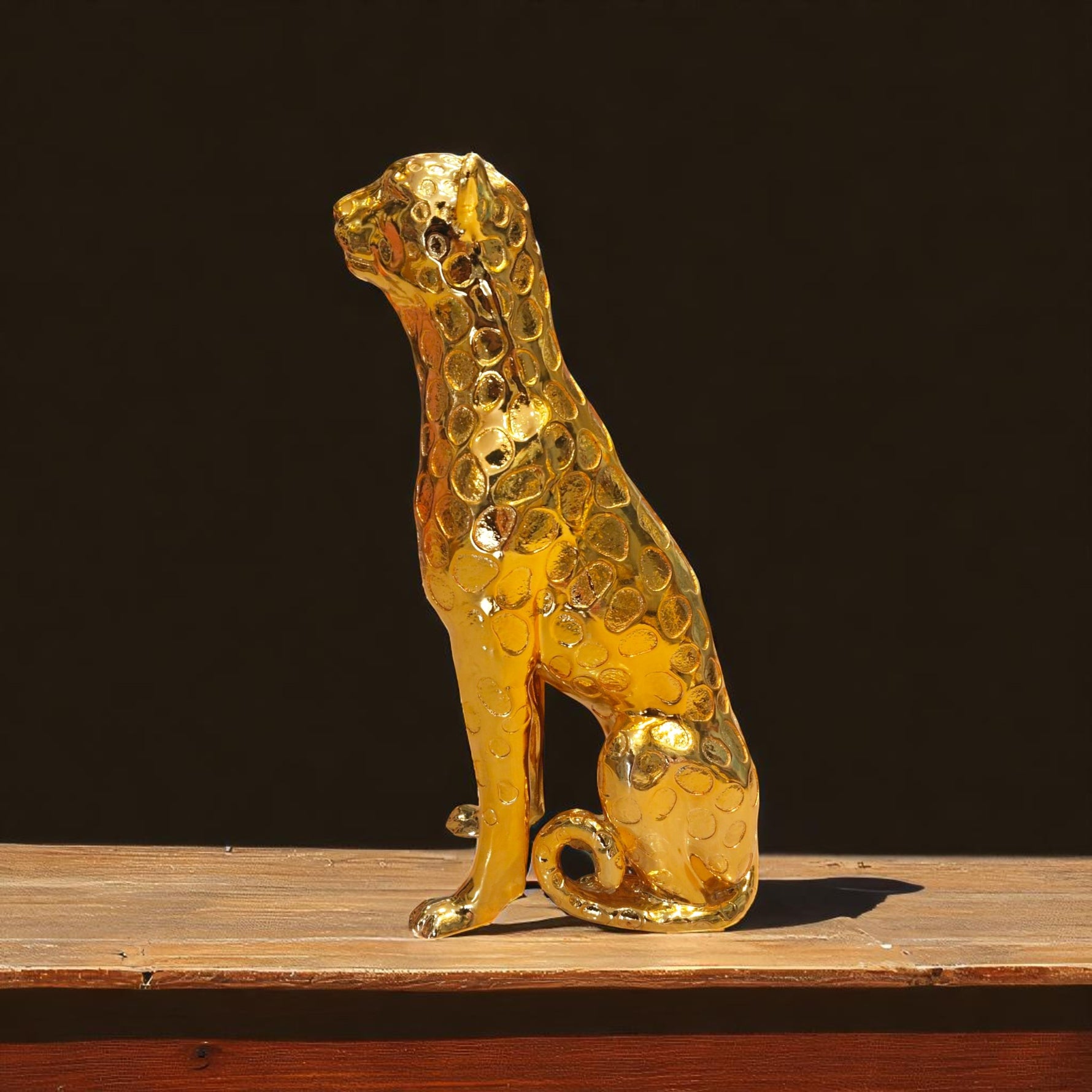 Side profile of panther-themed golden statue for luxury interiors