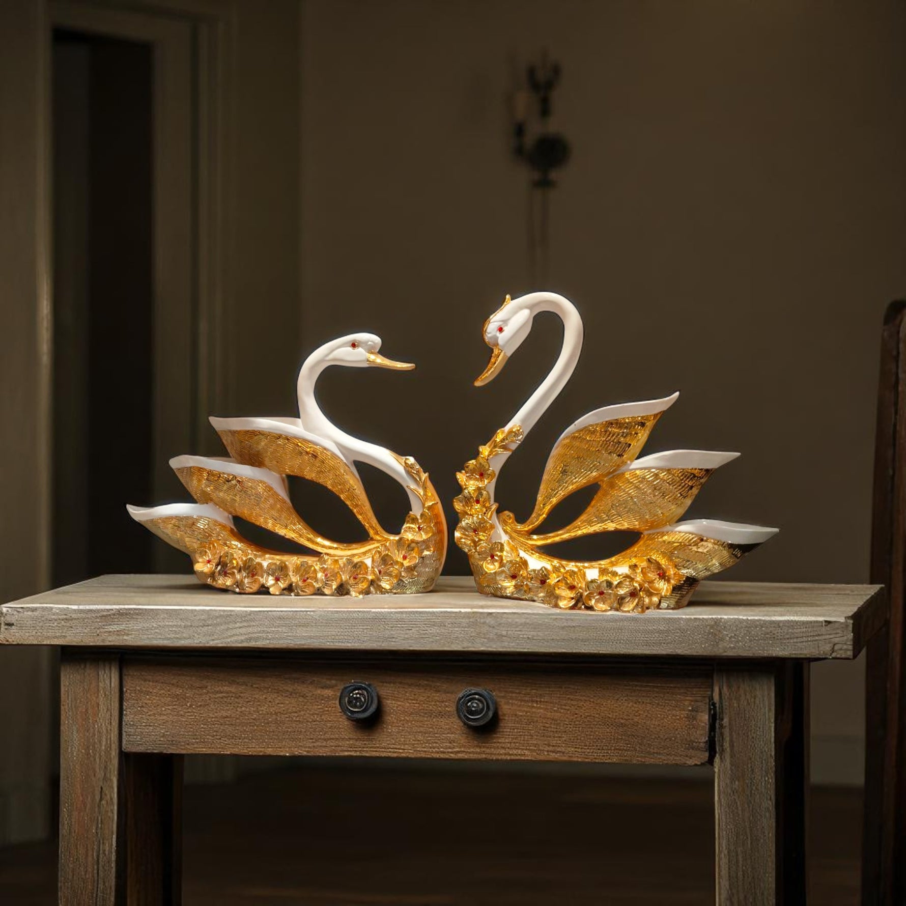Side angle of golden-winged swan figurines for romantic decor