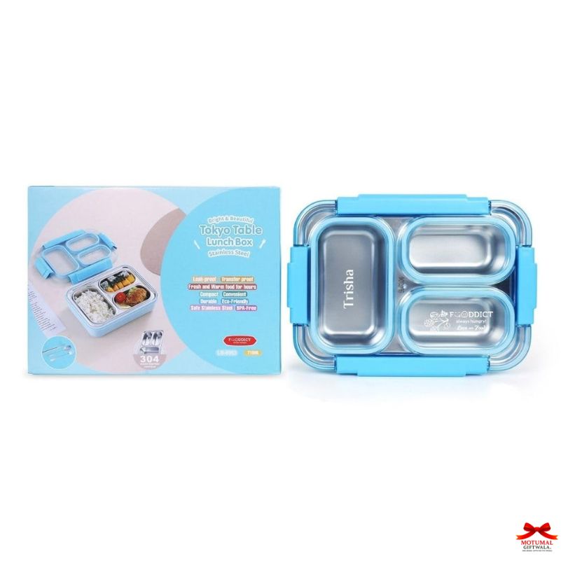 Blue Trisha lunch box with packaging on a white background