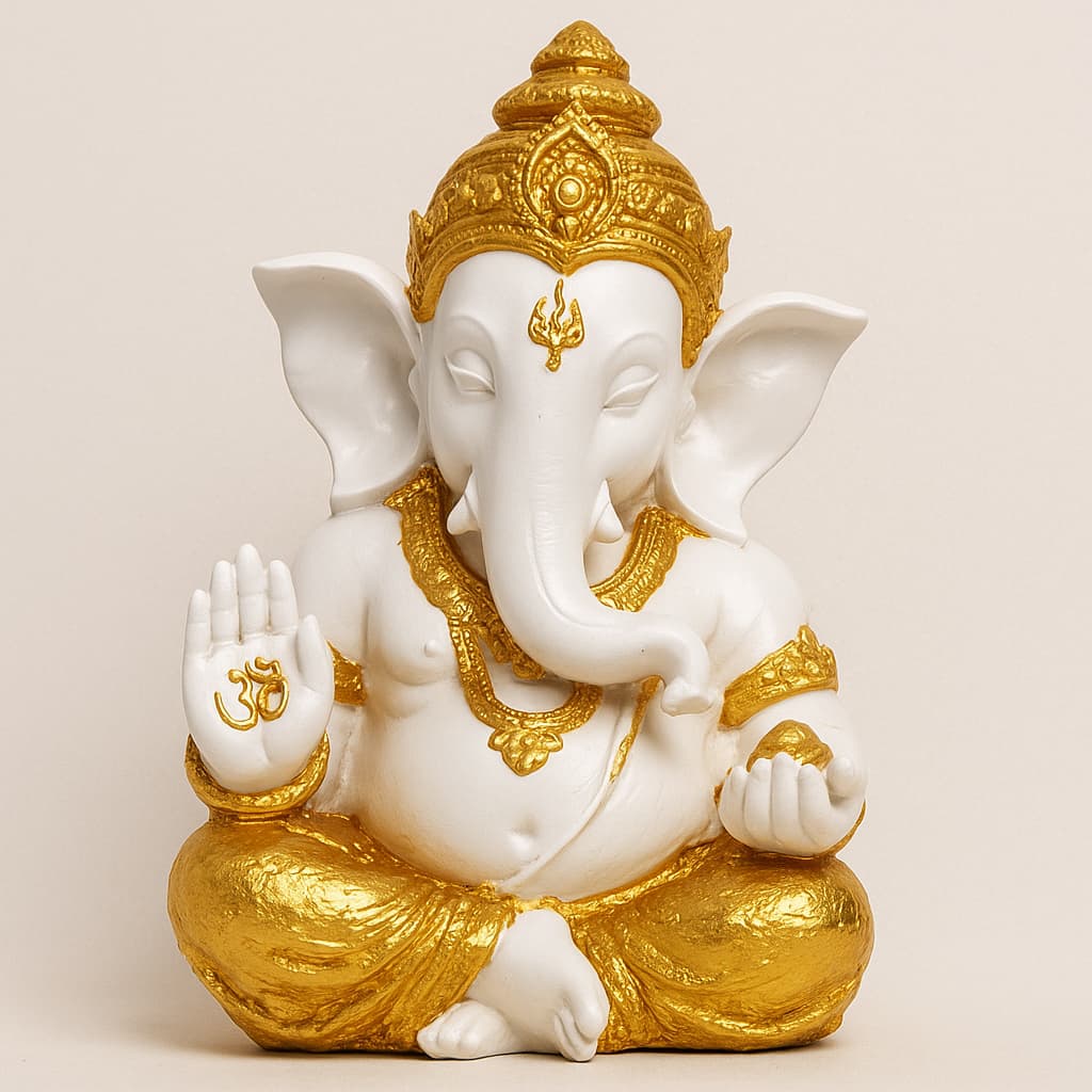 White and golden resin Ganesh idol with Om symbol – spiritual gift and home mandir decor by Motumal Giftwala Ranchi