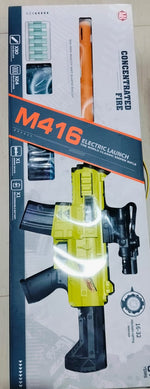 A toy gun packaged in a box, predominantly black and yellow in color, with the model number M416 visible.