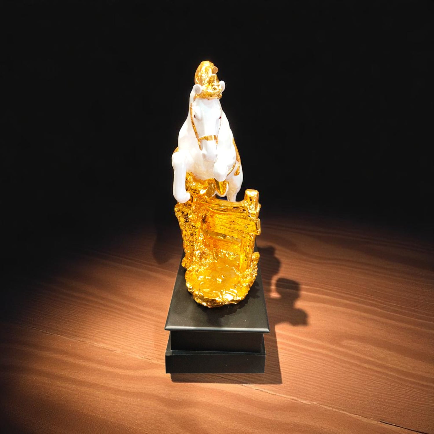  Front view of white jumping horse showpiece over golden treasure