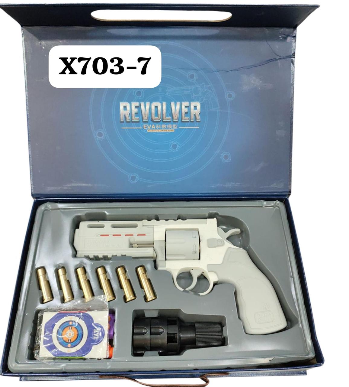 A revolver pistol named X703 7, displayed in its open box with ammunition and cleaning accessories visible.