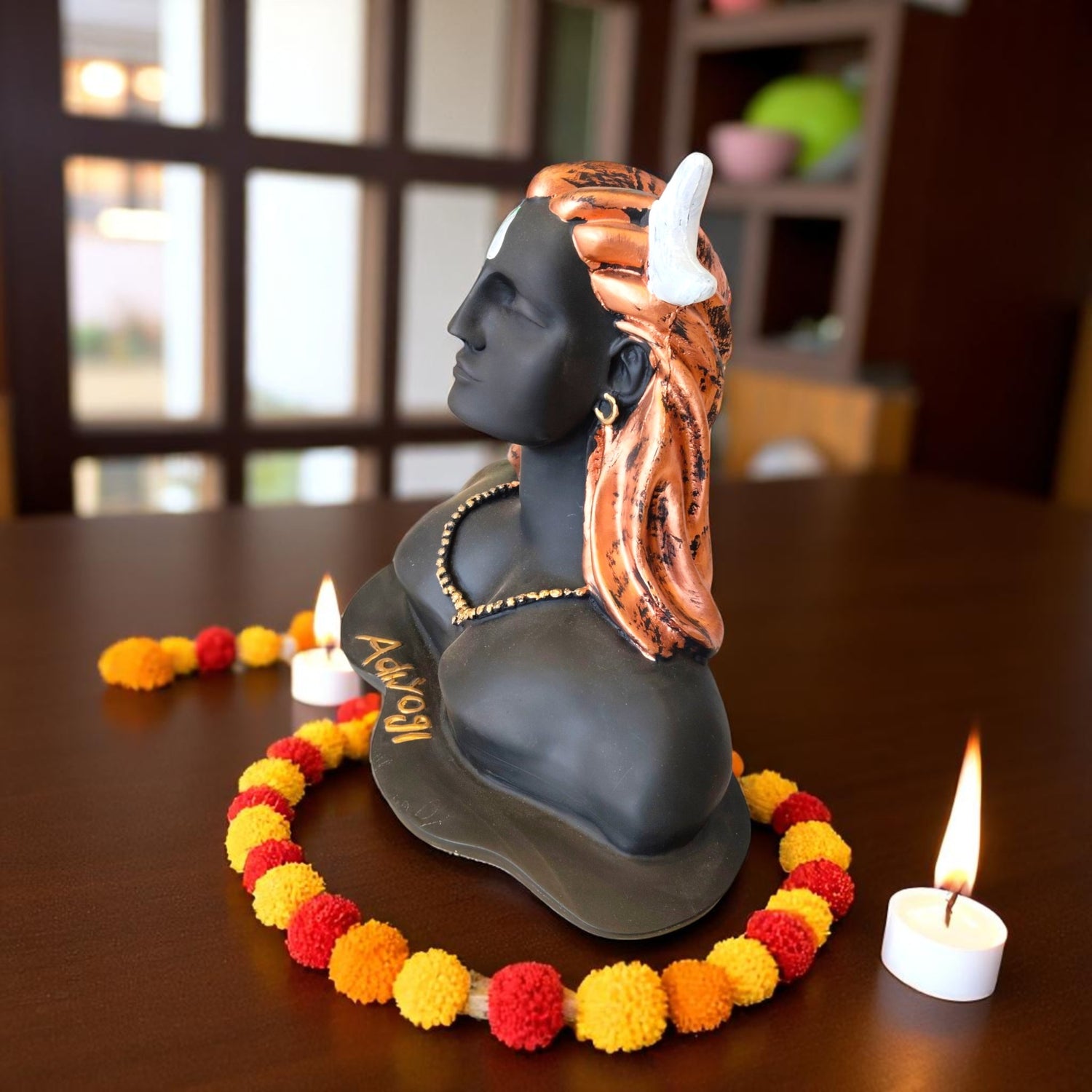 Side view of Adiyogi Mahadev sculpture with calm expression and white crescent moon