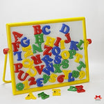 Colorful magnetic letters and numbers on a white board with yellow frame