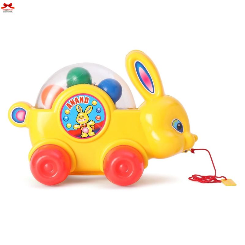 Colorful toy rabbit with a pull string on a white background