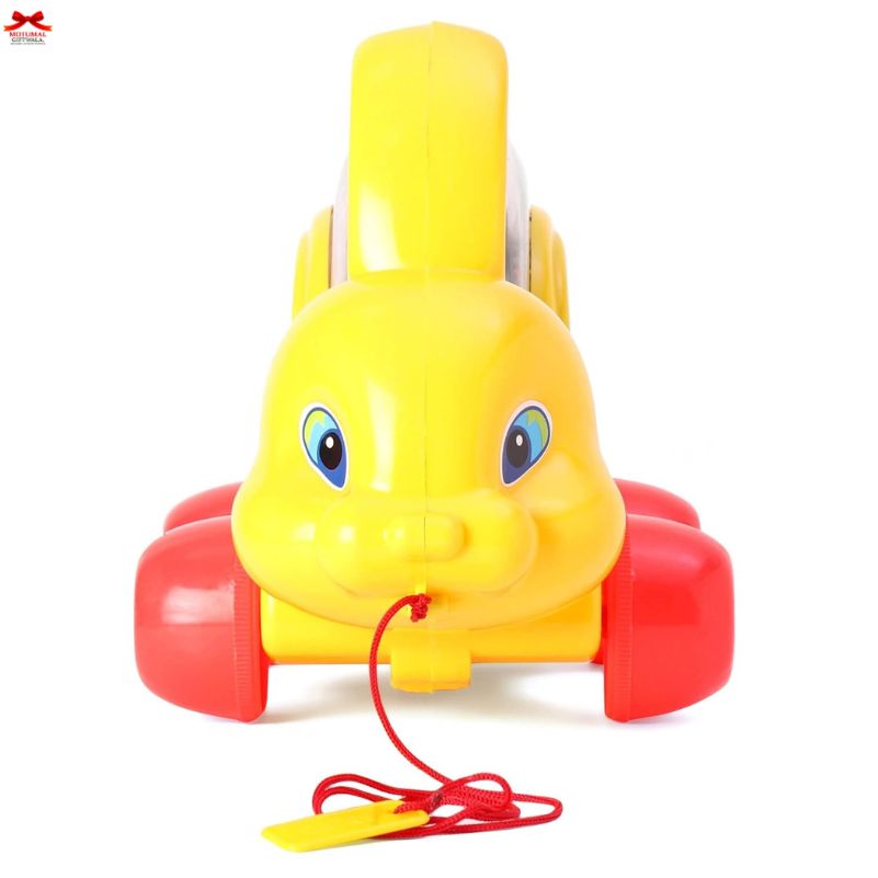 Yellow toy turtle with a red shell and string on a white background