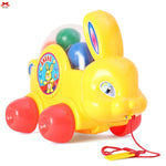 Yellow toy rabbit with colorful beads on a white background