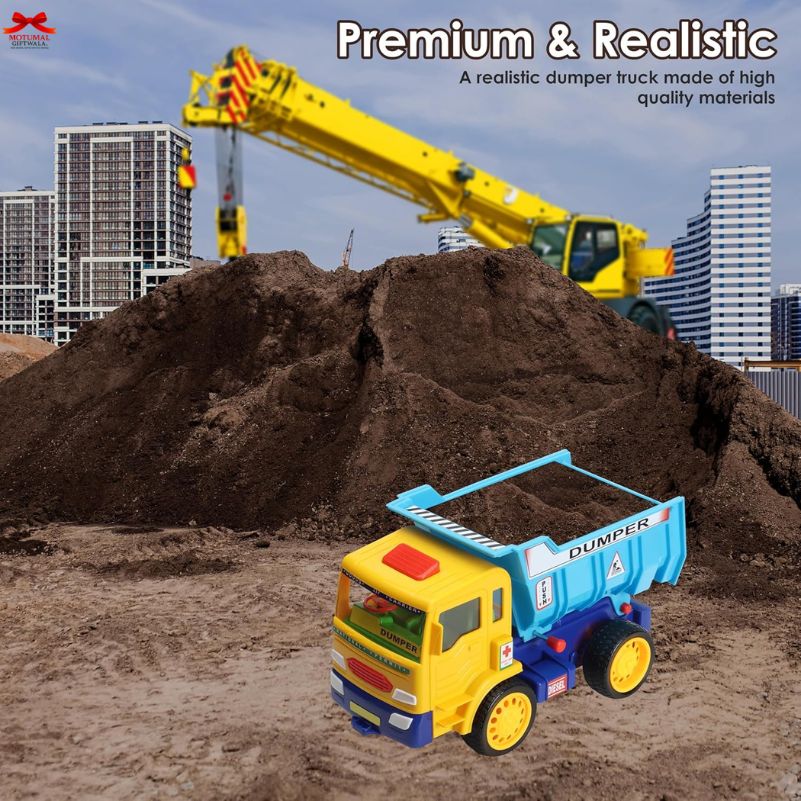 Toy dump truck in front of a large construction crane with buildings in the background