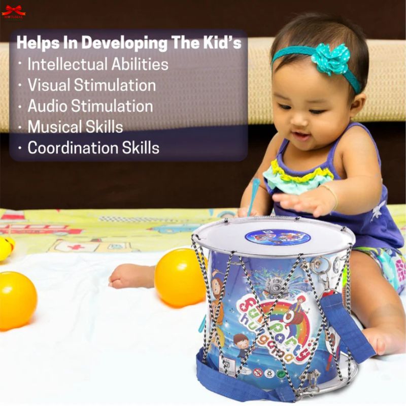 Baby playing with a colorful toy drum, sitting on a carpeted floor.