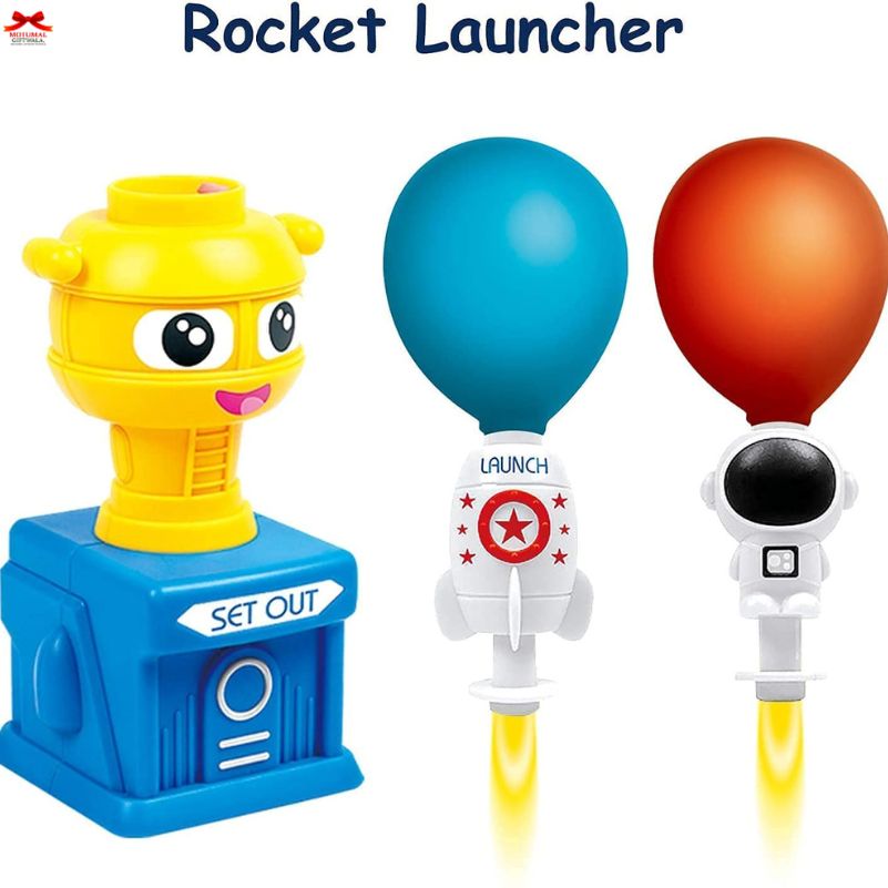 Toy rocket launcher with balloons on a white background
