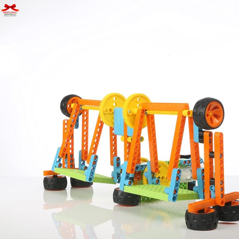 Colorful toy mechanical model with gears and wheels on a white background