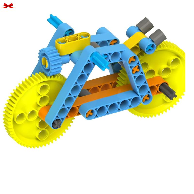 Toy construction set resembling a motorcycle with yellow and blue gears on a white background
