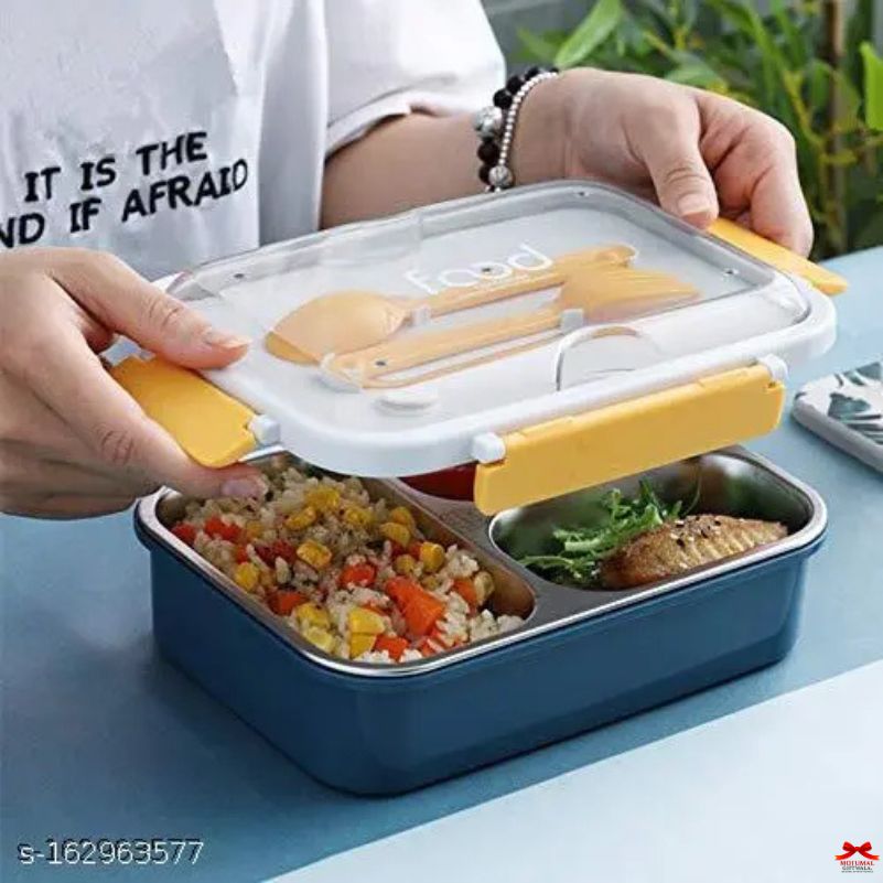 Blue bento box with food compartments and yellow lids on a blue surface.