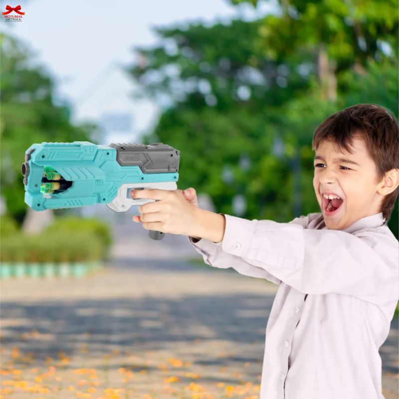Child playing with a toy gun outdoors