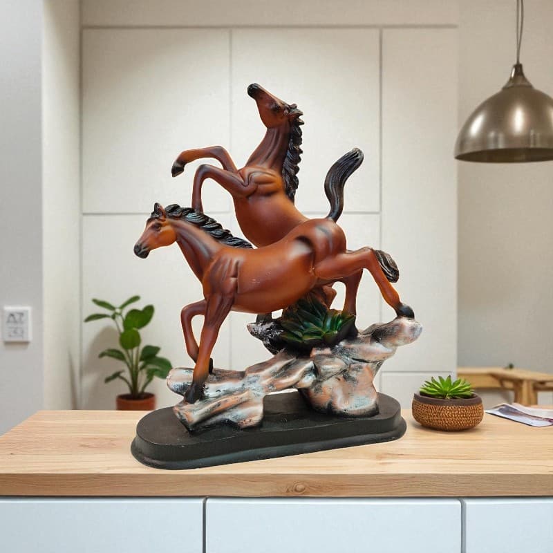 Statue of three horses on a rock in a home setting