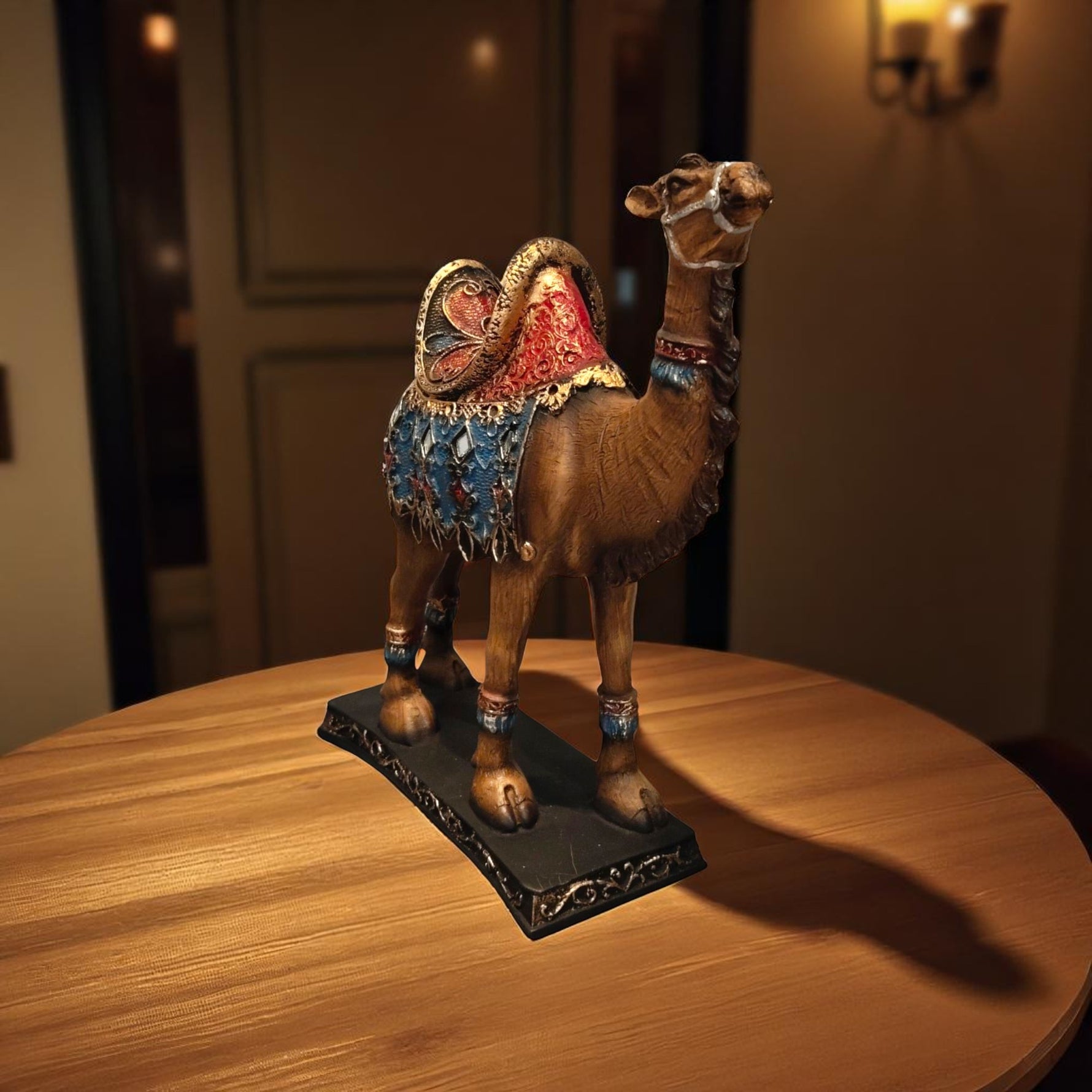 Right profile showing detailed hand-painted saddle of camel figurine