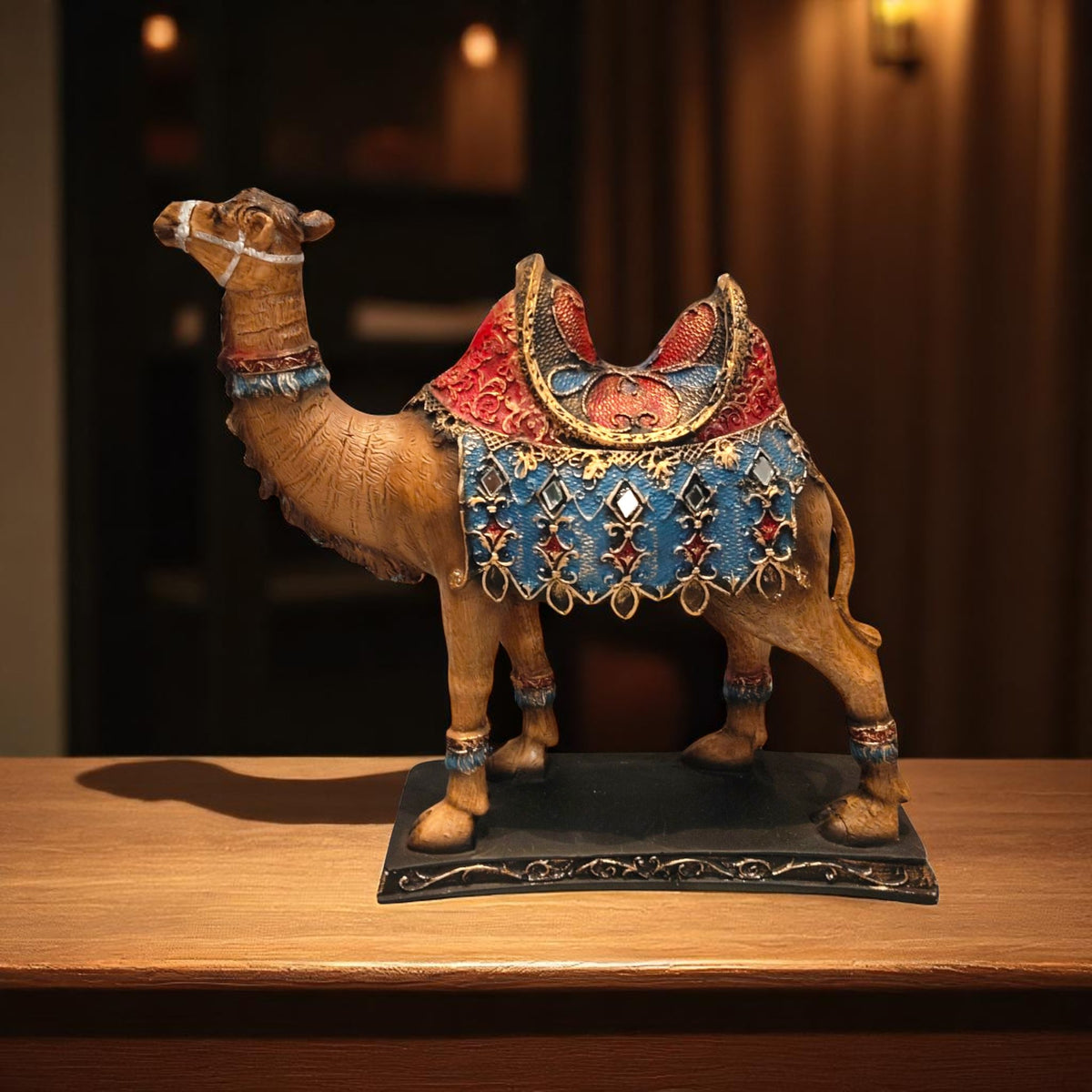 Front angle view of traditional royal camel statue on wooden table