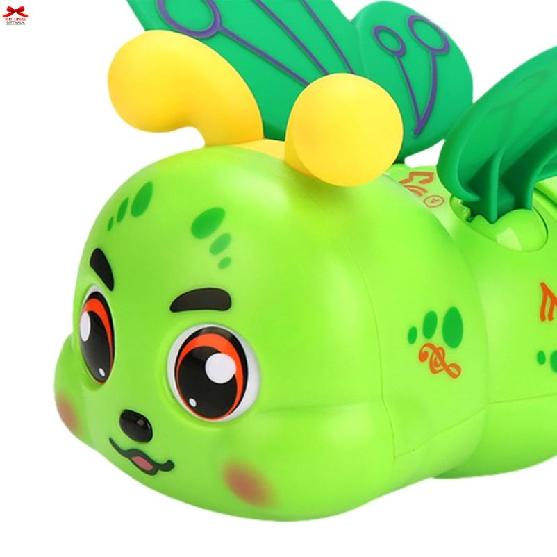 Green toy caterpillar with yellow polka dots on a white background
