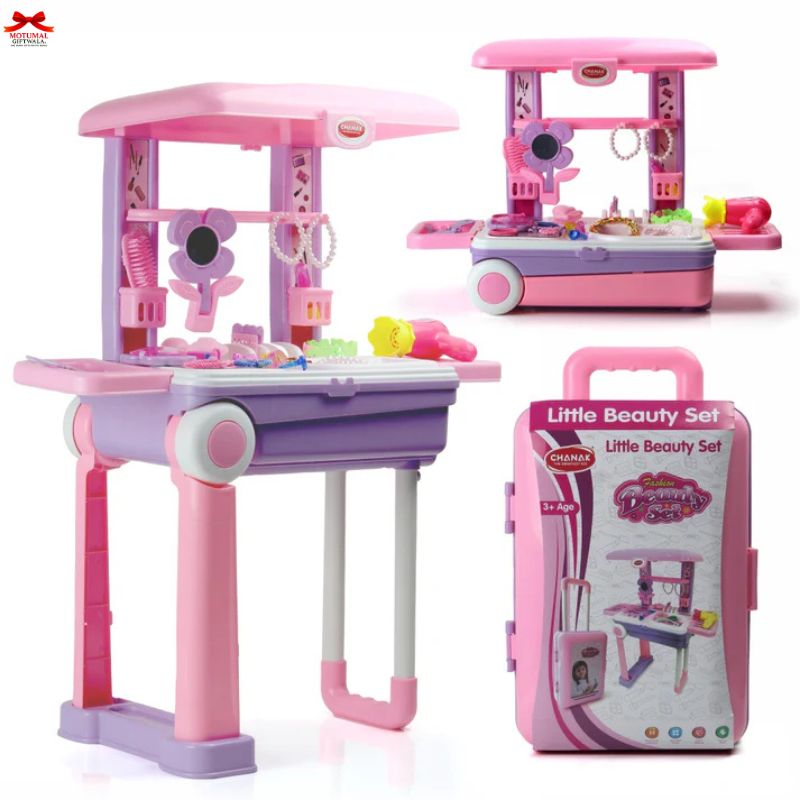 Pink and purple toy beauty set with accessories and packaging on a white background