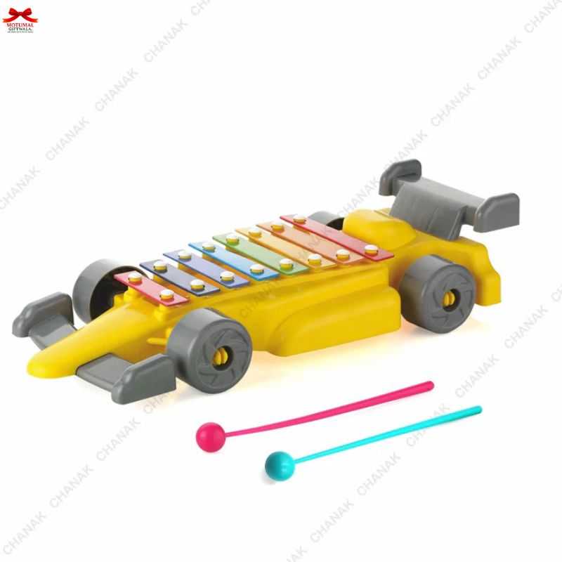 Toy car with xylophone keys and two mallets on a white background