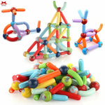Colorful magnetic building toys on a white background