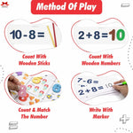 Educational materials for learning math with wooden sticks, numbers, and markers.