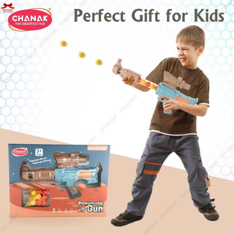 Child playing with a toy gun next to its packaging, with 'CHANAK' branding.