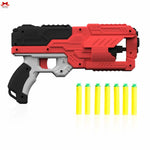 Red and black toy blaster with yellow darts on a white background
