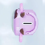 Top view of purple cow piggy bank with coin slot and handle