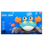 Box of a toy crab with light and sound features on a blue background
