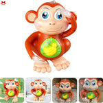 Toy monkey with a banana on a white background