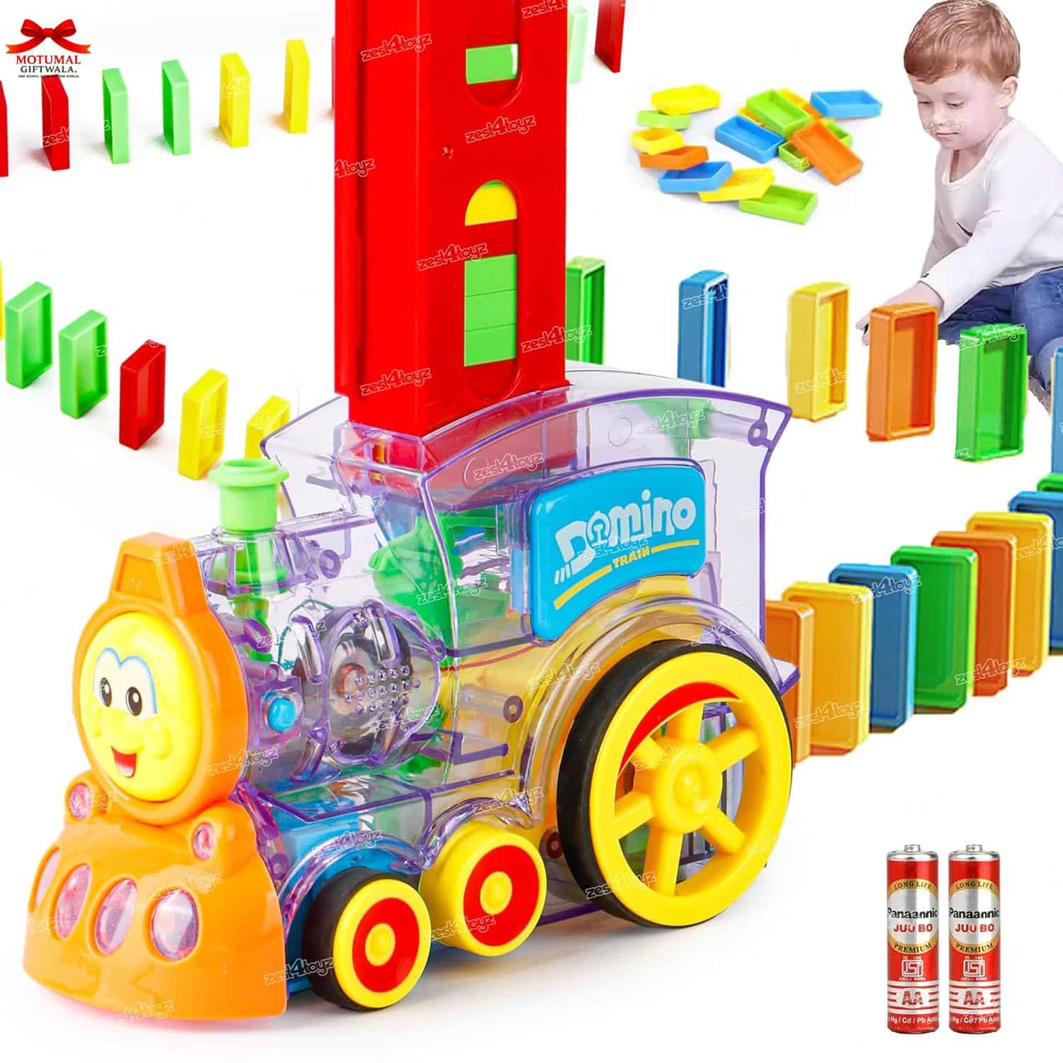 Colorful toy train set with dominoes and a child playing in the background