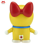 Toy figure with a red bow and yellow body on a white background