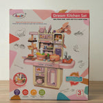 Back side of Dream Kitchen Set toy box with illustration of kitchen setup, utensils, and realistic steam function.