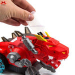 Red toy dinosaur with a hand holding a white strip, on a white background