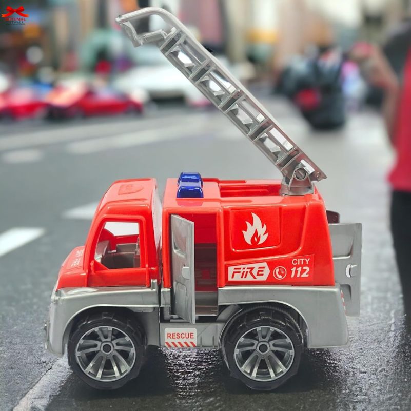 Toy fire truck on a wet road with blurred background