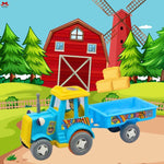 Toy tractor with a blue trailer and yellow roof in front of a red barn and windmill on a farm.