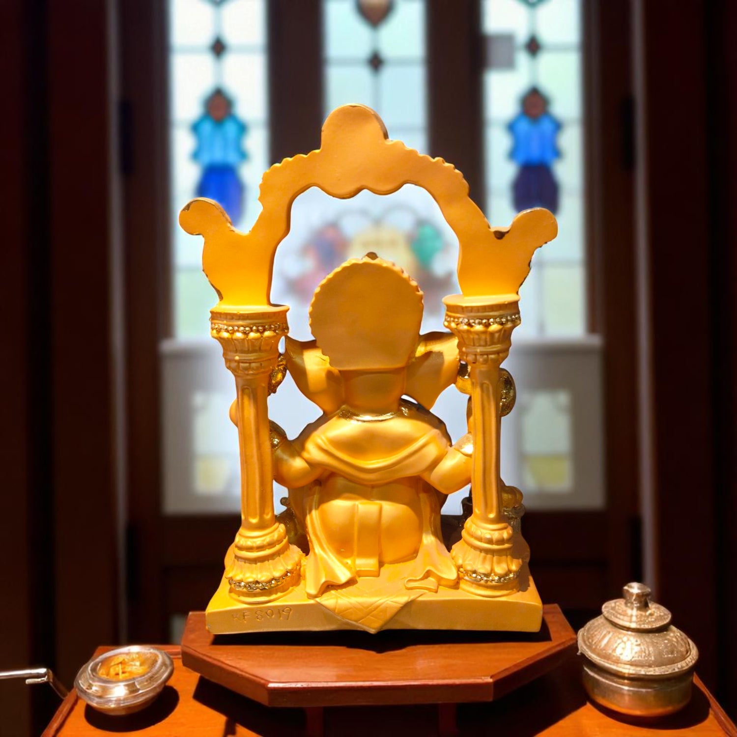Back view of Ganesh idol showing arch design and fine detailing