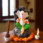 Front view of Ganpati murti with green dhoti and orange stole for home décor