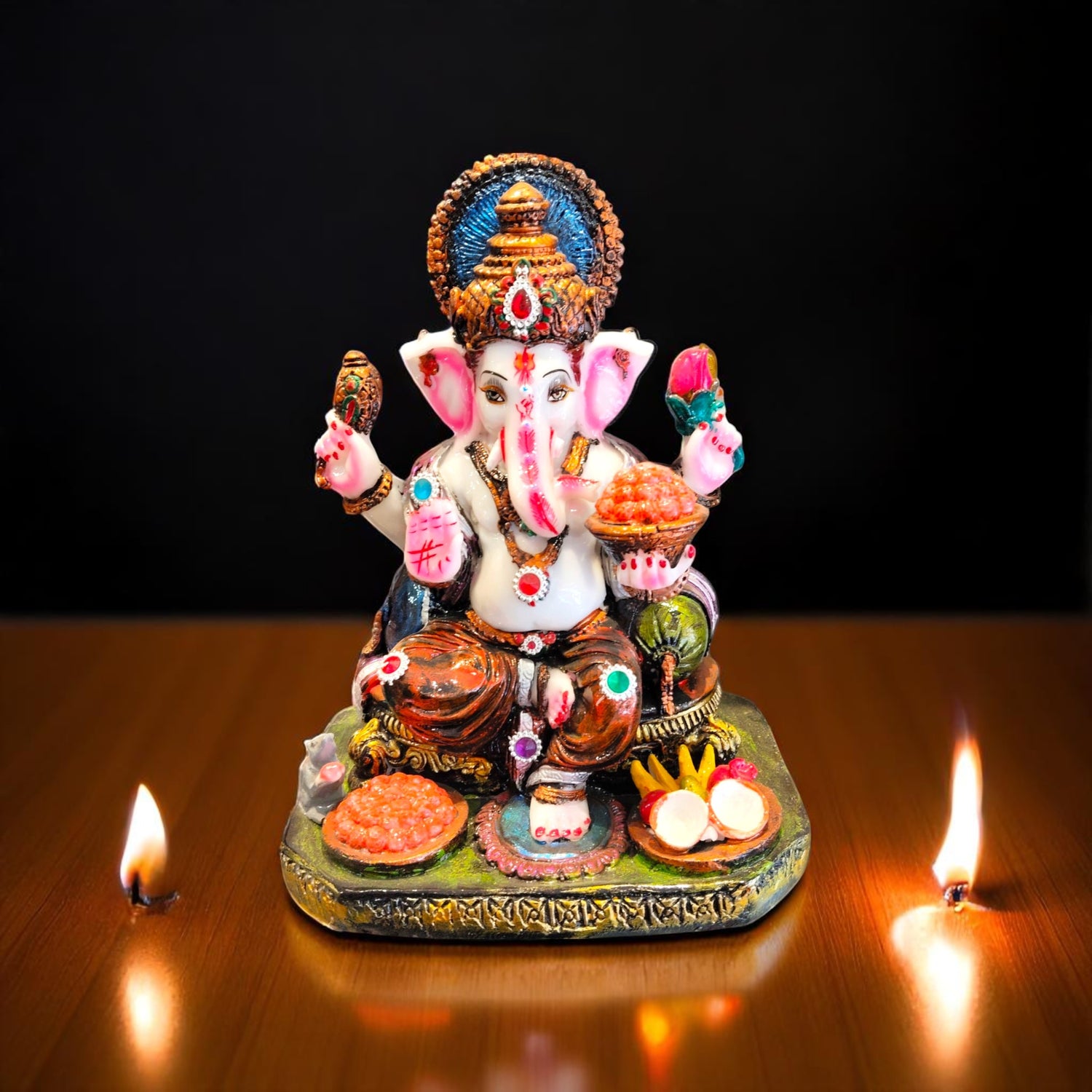  Front view of traditional Ganesha idol with kundan stones and pooja elements