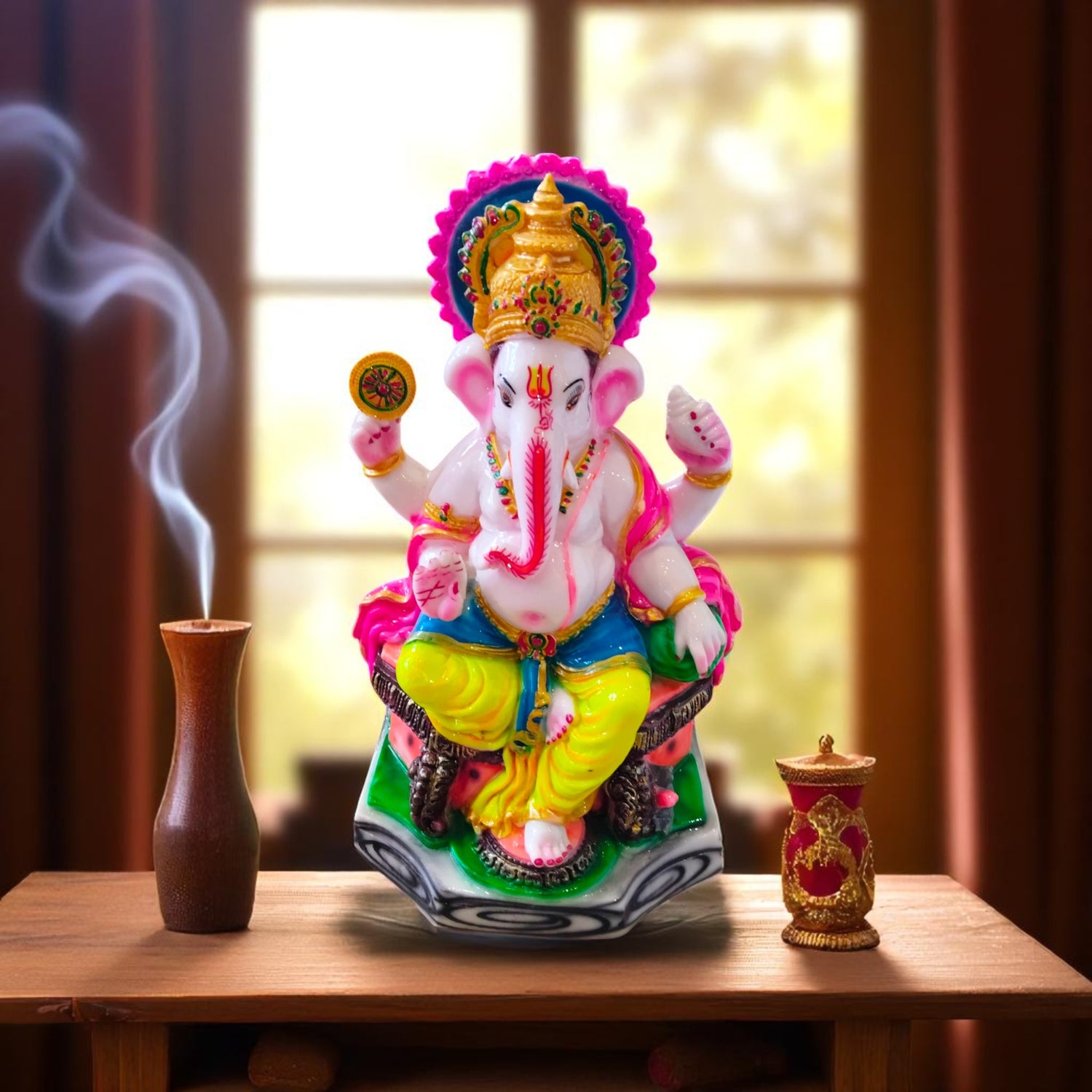  Front view of multicolor Ganesha idol with golden crown and chakra in hand