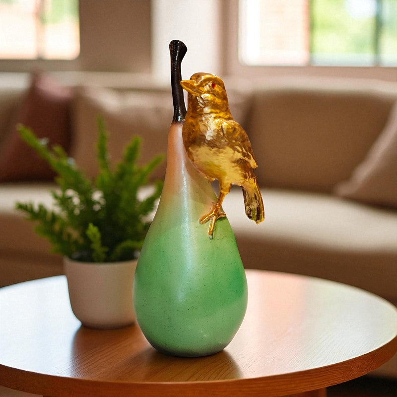 Decorative green vase with a gold bird on top in a living room setting