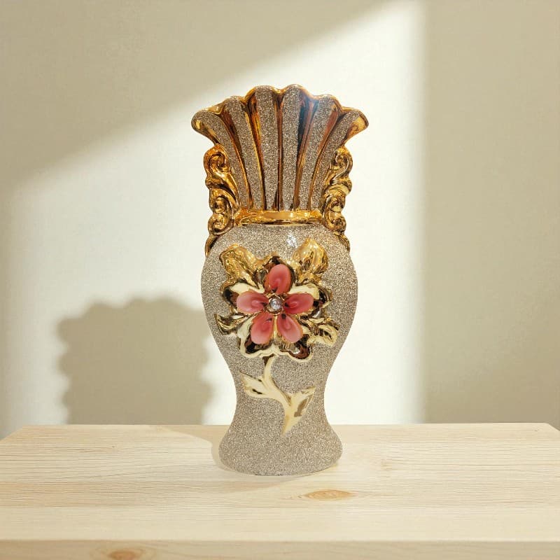 Decorative vase with floral design on a wooden surface
