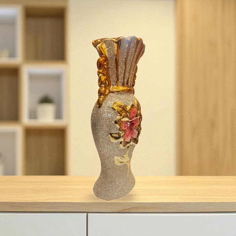 Decorative vase with floral design on a wooden shelf
