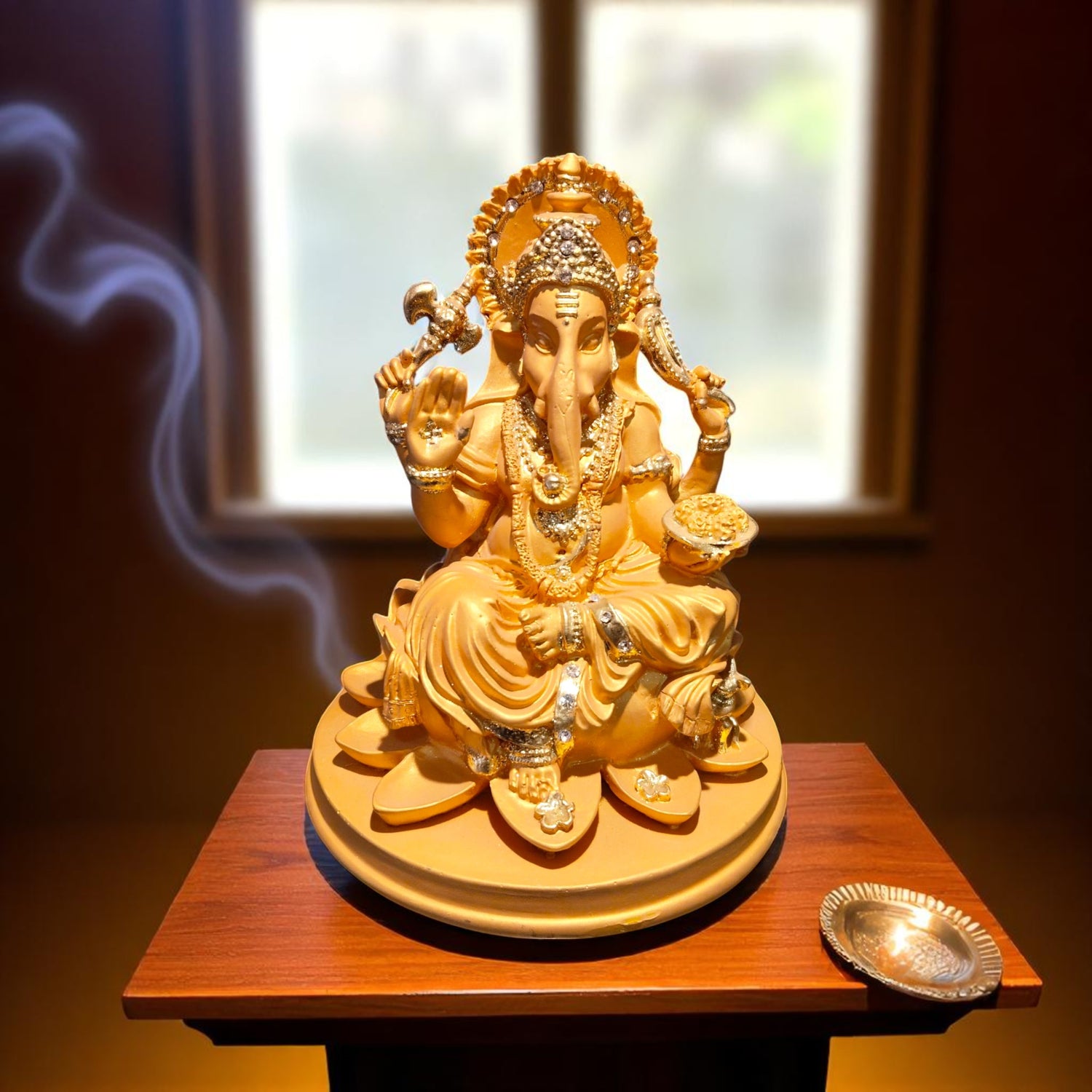 Front view of Ganpati Bappa idol with diya in natural light