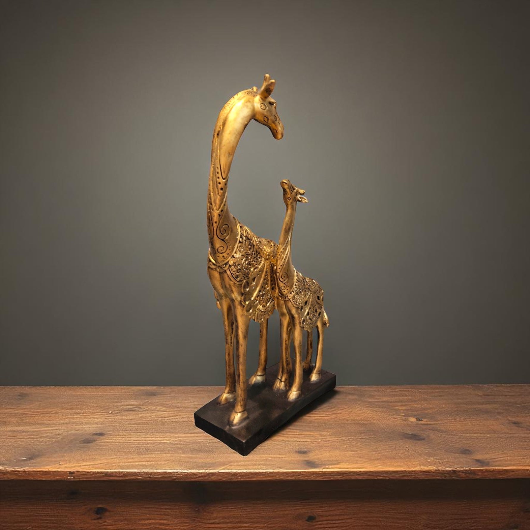 Side angle of handcrafted giraffe pair idol in antique gold design