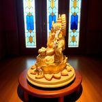 Side angle showing hand-carved details on lotus base